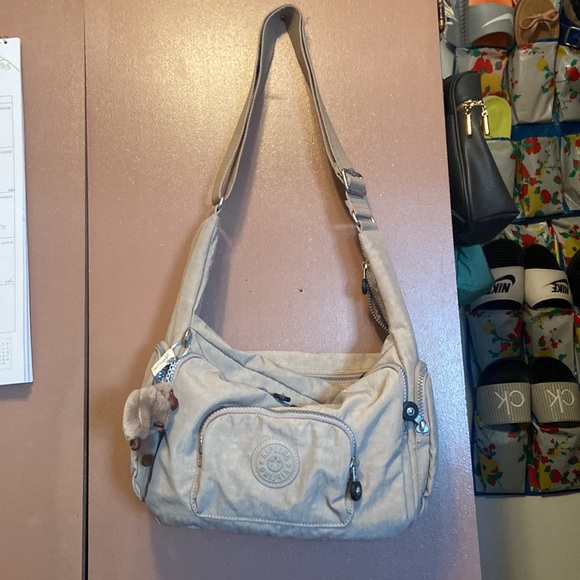 Kipling. 101/2 long x 9 high x 5 deep. New, no tags, beige. Perfect condition. - Picture 2 of 5
